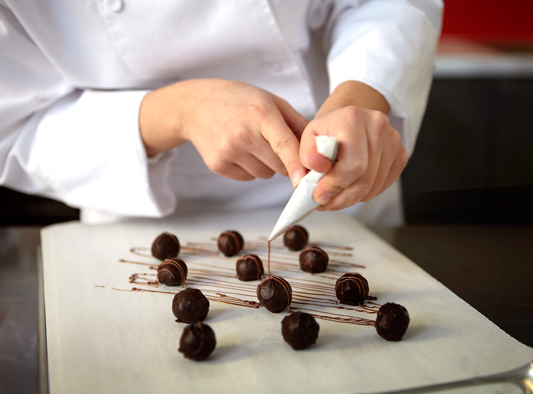 piping chocolate on truffles